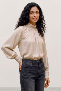 Front image of a model wearing the Sunny ls top in cream, by brand Vero moda