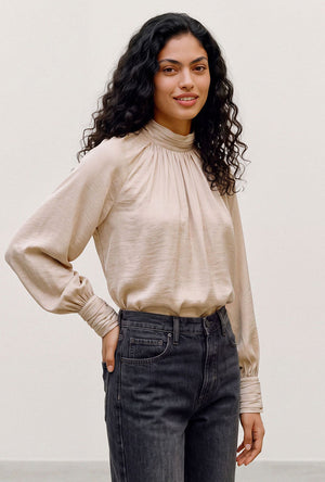 Front image of a model wearing the Sunny ls top in cream, by brand Vero moda