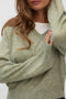 Front image of a model wearing the Teak ls vneck pullover in light green, by brand Vero moda