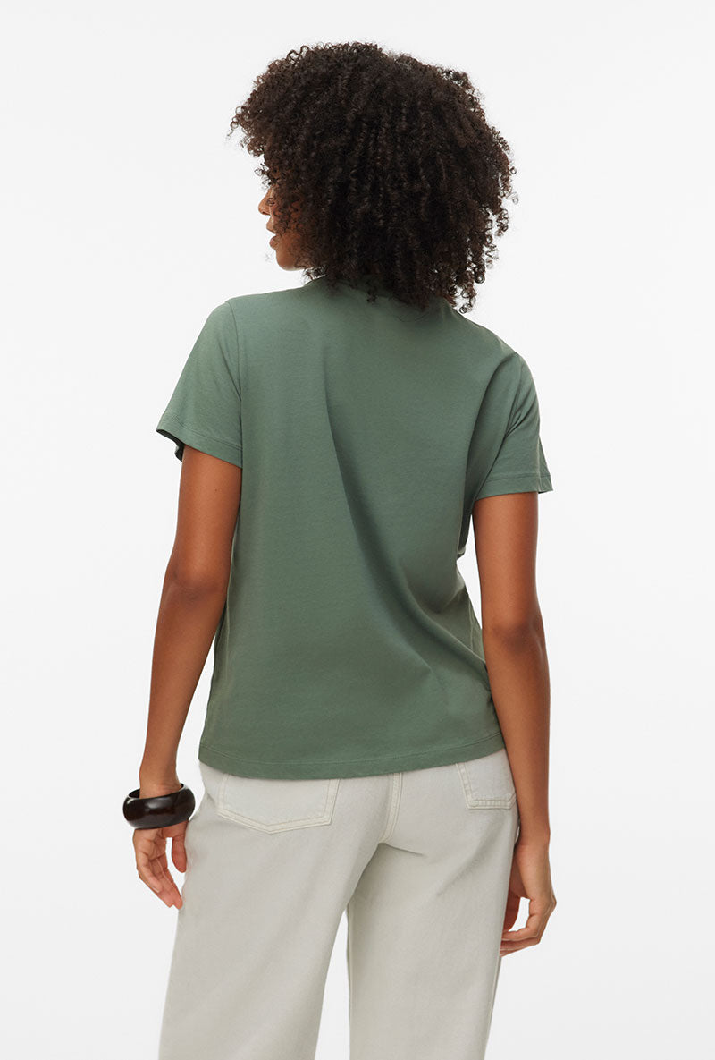 Back image of a model wearing Vanja francis ss top in green, by brand Vero moda