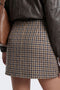 Back image of a model wearing the Violeta hw check slit skirt in brown, by brand Only