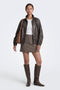 Front image of a model wearing the Violeta hw check slit skirt in brown, by brand Only