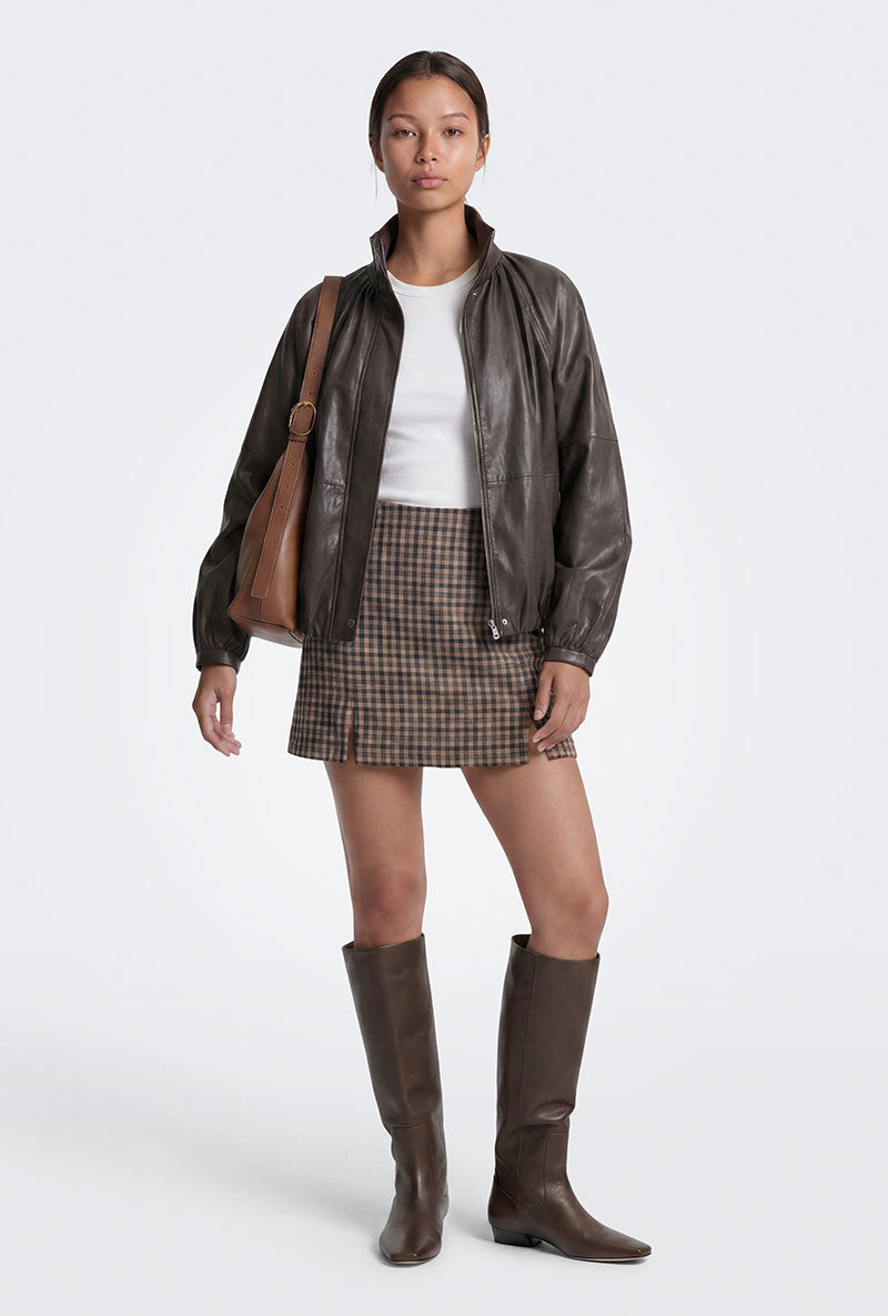 Front image of a model wearing Violeta hw check slit skirt in brown, by brand Only