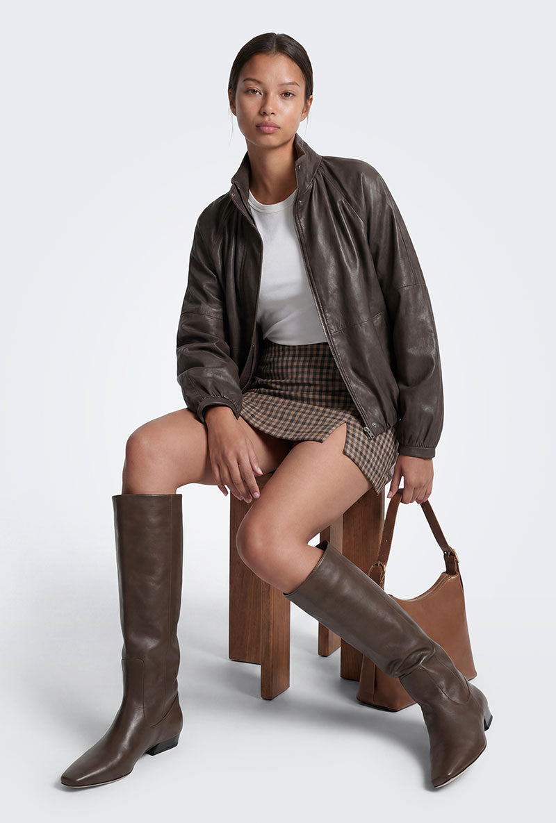 Front image of a model wearing Violeta hw check slit skirt in brown, by brand Only